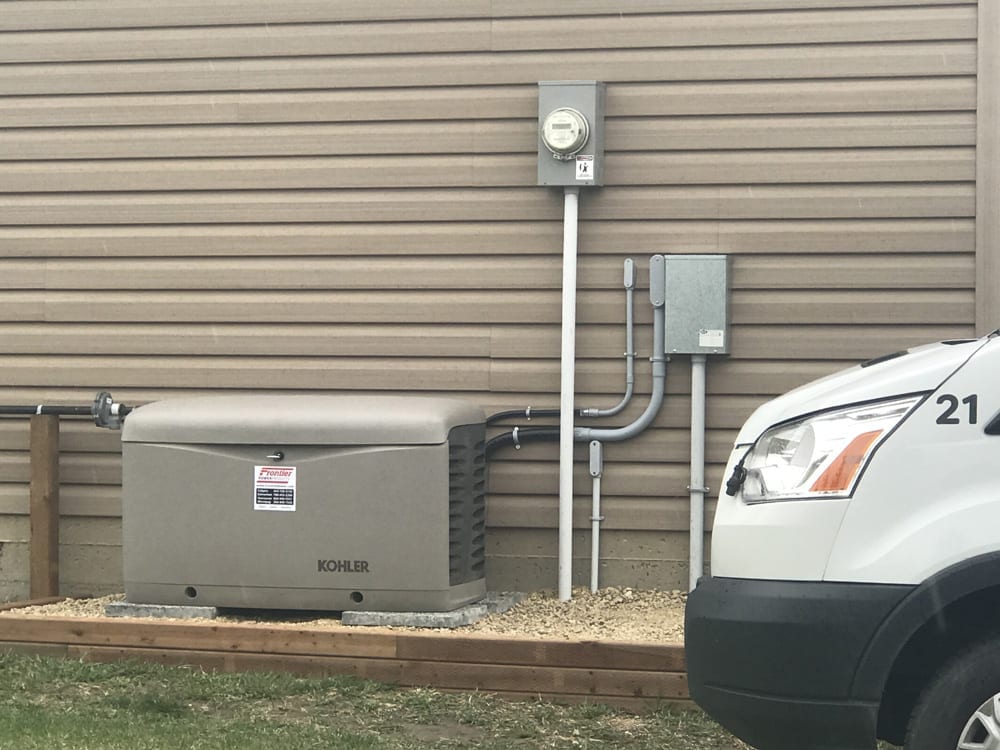 image of a 20kW Kohler generator installed outside a rural alberta residence