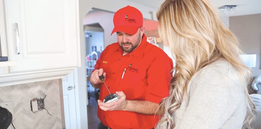 Image of Exquisite Electric Residential Electrician Bryan Fixing a Plug