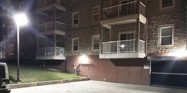 image of exterior lighting installed by Exquisite Electric to provide increased safety and security at an Okotoks condo building.