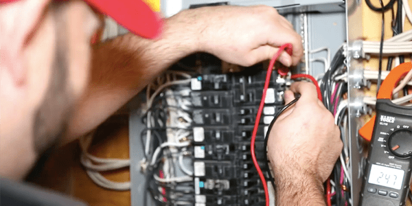 Image of Exquisite Electric Bryan Kenly Performing an Electrical Inspection on an Electrical Panel