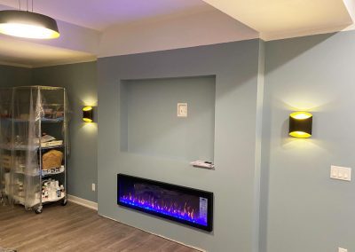 image of Electric Fireplace and theater lighting installed in basement
